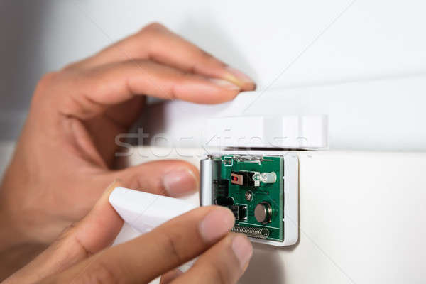 Technician Repairing Security System Door Sensor Stock photo © AndreyPopov