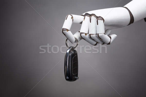 Robot Holding Car Key Stock photo © AndreyPopov