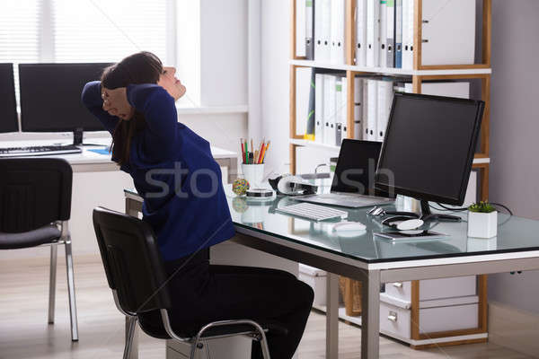 Businesswoman Stretching Her Arms Stock photo © AndreyPopov