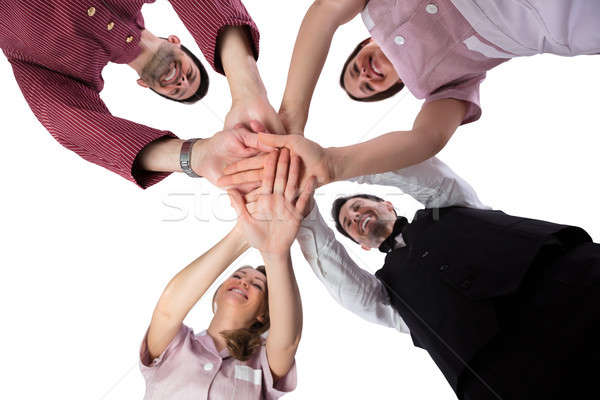 Hotel Staff Stacking Their Hands Stock photo © AndreyPopov