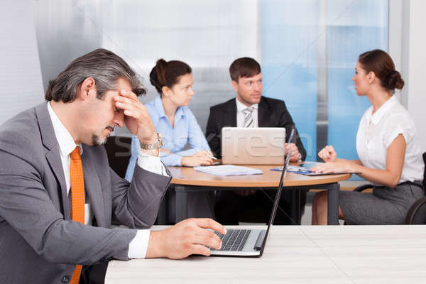 Stock photo: Overworked Businessman With Laptop