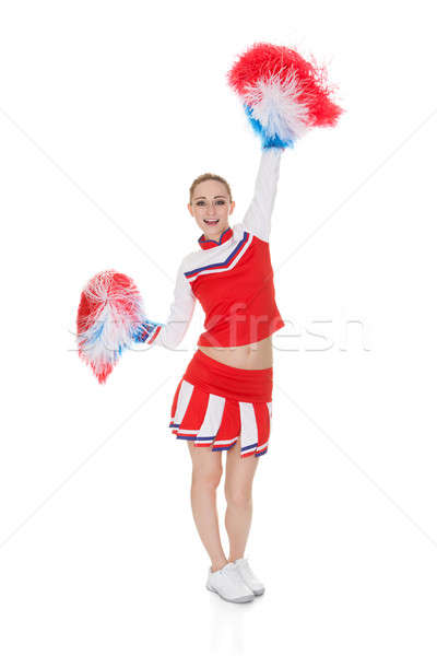 Young Cheerleader Holding Pom-poms Stock photo © AndreyPopov