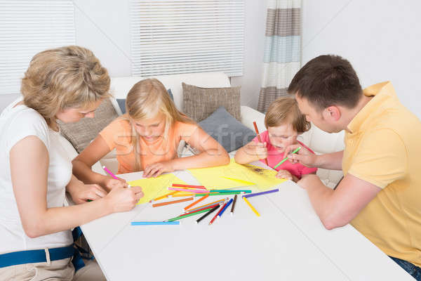 Young Family Drawing Together With Kids Stock photo © AndreyPopov