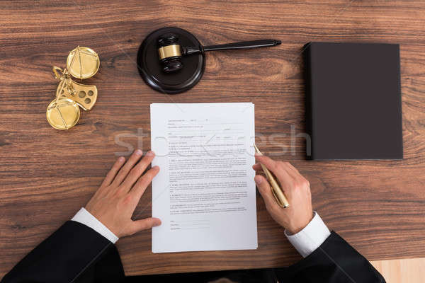 Judge Reading Paper In Courtroom Stock photo © AndreyPopov