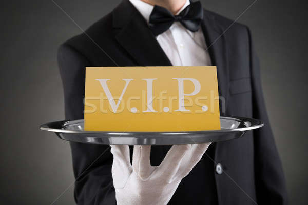 Waiter Showing Vip Text On Banner Stock photo © AndreyPopov
