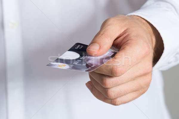 Businessman Holding Credit Card Stock photo © AndreyPopov