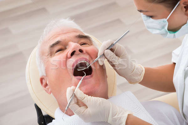 Man Undergoing Dental Treatment Stock photo © AndreyPopov