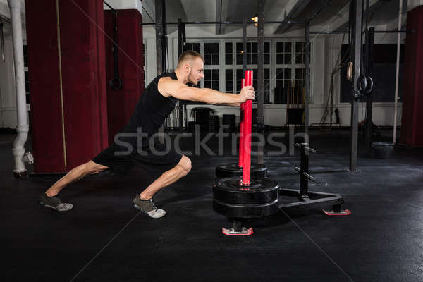 Férfi edz tornaterem fiatal atléta képzett Stock fotó © AndreyPopov