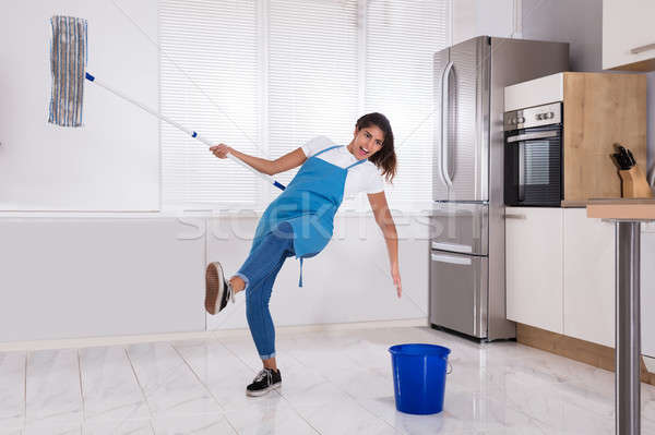 Janitor Slipping While Mopping Floor Stock photo © AndreyPopov