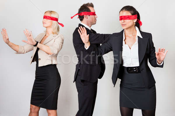 Group of disoriented businesspeople Stock photo © AndreyPopov
