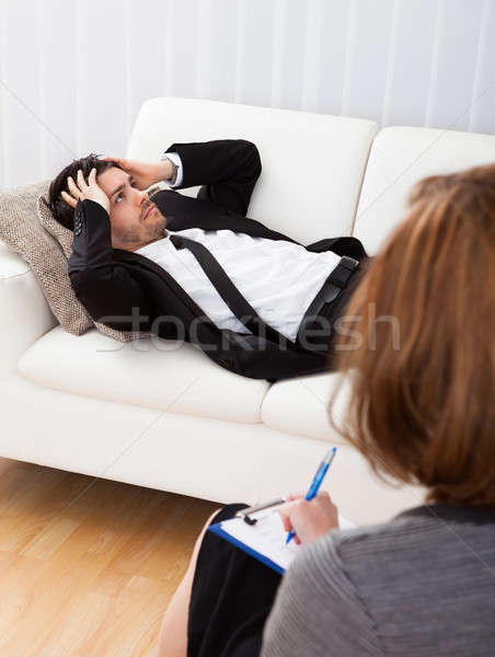 Stock photo: Business man talking to his psychiatrist explaining something