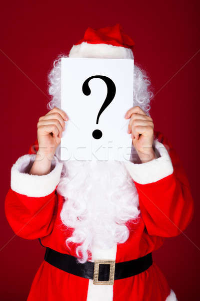 Santa holding question mark in front of his face Stock photo © AndreyPopov