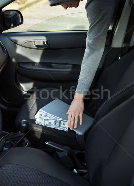 Thief Stealing Laptop And Money Through Car Window Stock photo © AndreyPopov