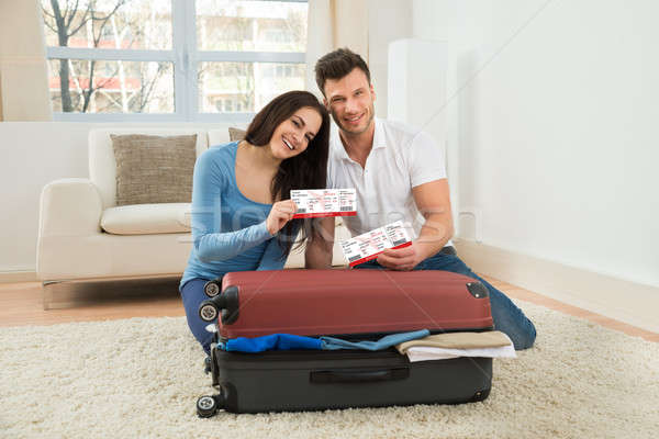 Happy Young Couple Showing Boarding Pass Stock photo © AndreyPopov