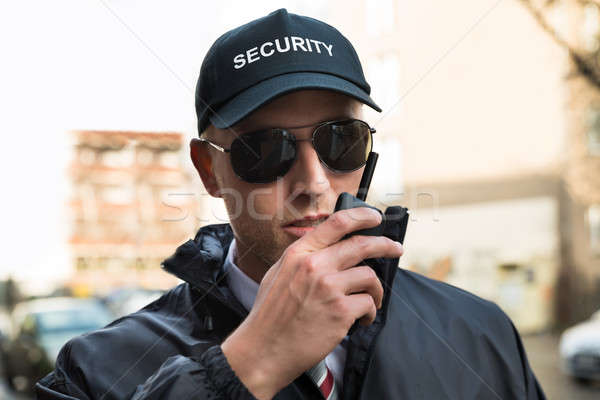 Security Guard Talking On Walkie-talkie Stock photo © AndreyPopov
