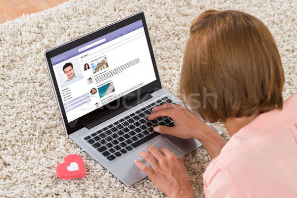 Stock photo: Woman With Heart Sign Chatting On Social Networking Site