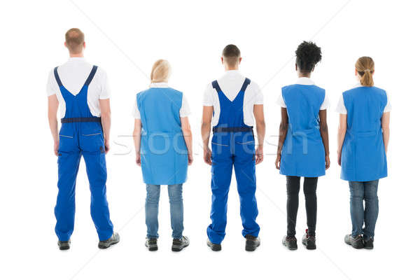 Rear View Of Multiethnic Janitors Standing In Row Stock photo © AndreyPopov