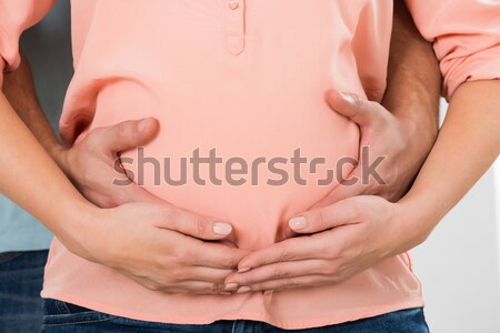 Couple With Hands On Pregnant Belly Stock photo © AndreyPopov