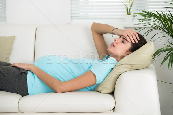 Pregnant Woman Suffering From Headache At Home Stock photo © AndreyPopov