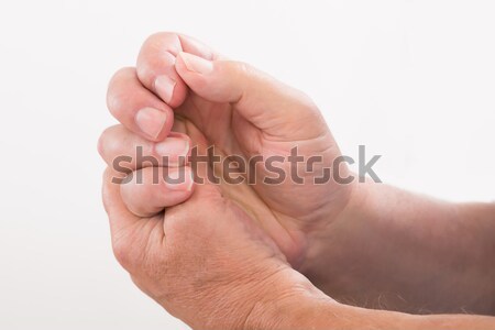 Person Pressing His Palm With Thumb Stock photo © AndreyPopov