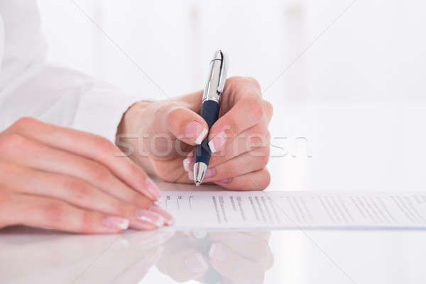Female's Hand Filling Form Stock photo © AndreyPopov