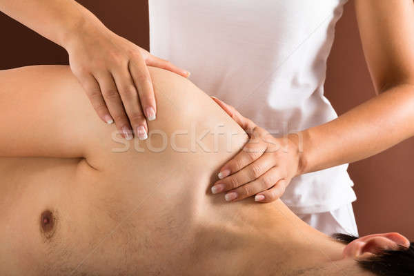 Młody człowiek masażu spa strony człowiek Zdjęcia stock © AndreyPopov