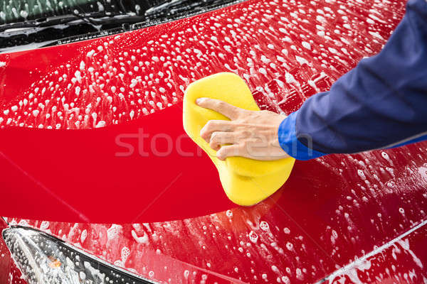 Worker's Hand Washing Red Car With Yellow Sponge Stock photo © AndreyPopov