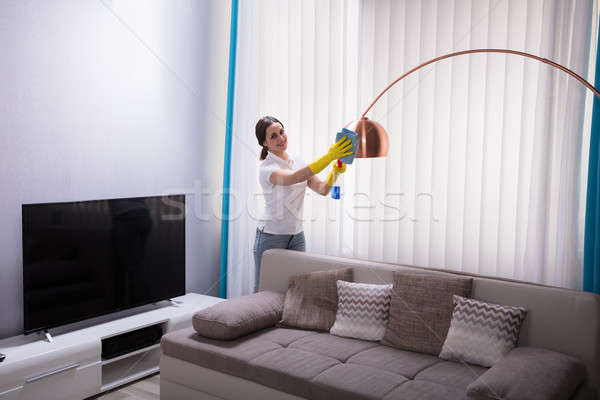 Female Janitor Cleaning Electric Light Stock photo © AndreyPopov