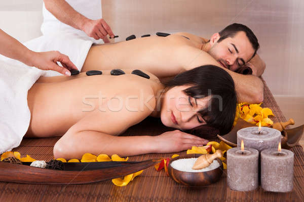 Beautiful Young Couple Enjoying Hot Stone Therapy Stock photo © AndreyPopov