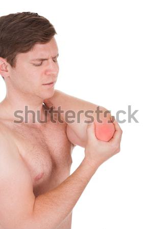 Man With A Shoulder Ache Stock photo © AndreyPopov