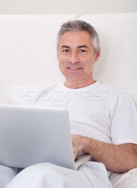 Homme mûr portable portrait heureux sourire cheveux [[stock_photo]] © AndreyPopov