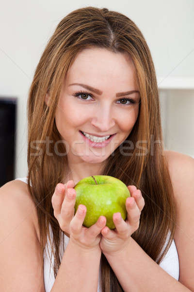 Happy Woman Holding Apple Stock photo © AndreyPopov