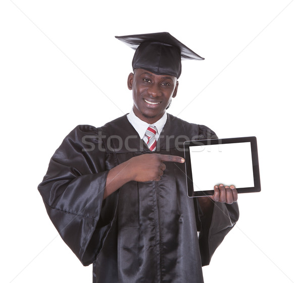Graduation Man Showing Tablet Pc Stock photo © AndreyPopov