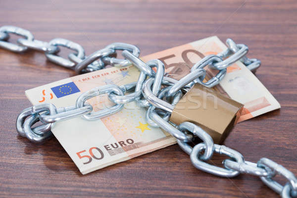 Euro Notes With Chain And Padlock On Table Stock photo © AndreyPopov