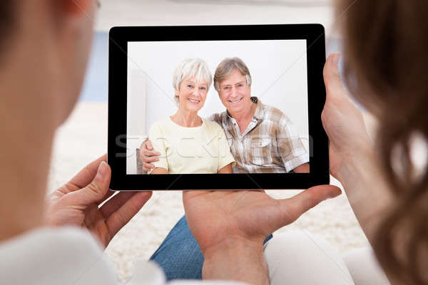 Couple having video conference Stock photo © AndreyPopov