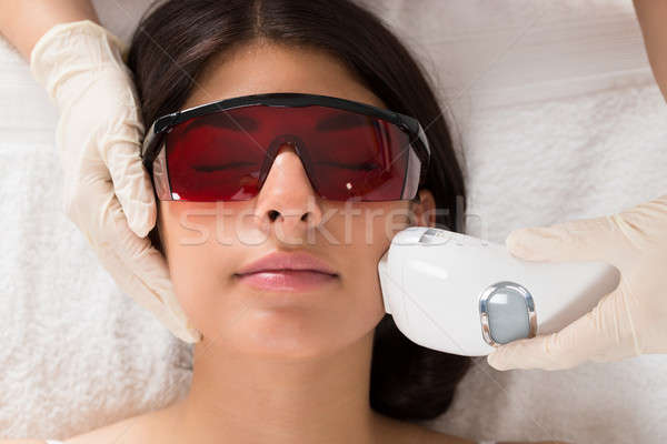 Beautician Giving Epilation Laser Treatment Stock photo © AndreyPopov
