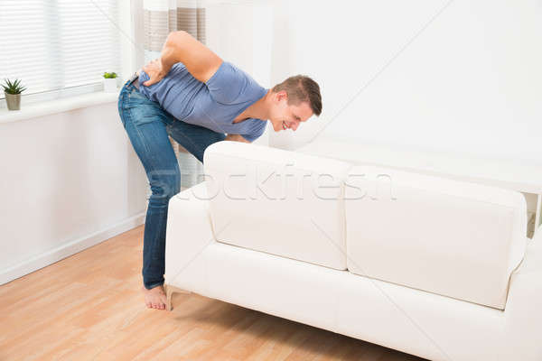 Foto stock: Homem · sofrimento · sofá · moço · sala · de · estar