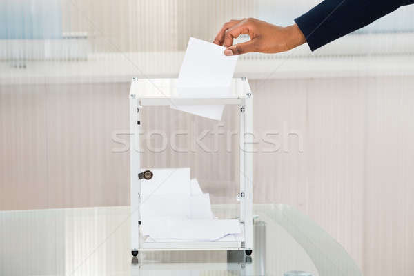 Person's Hand Putting Ballot In Box Stock photo © AndreyPopov