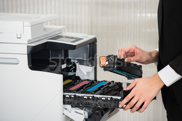 Empresário cartucho impressora máquina escritório Foto stock © AndreyPopov