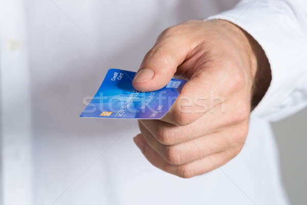 Businessman Holding Credit Card Stock photo © AndreyPopov