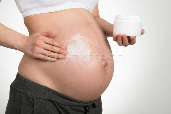 Mujer crema vientre gris salud Foto stock © AndreyPopov