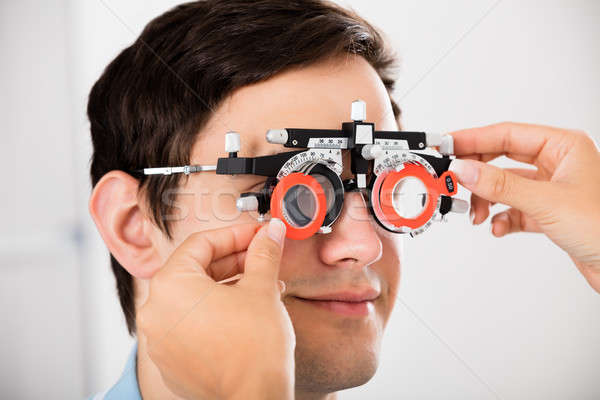 Optometrista paciente visión marco primer plano masculina Foto stock © AndreyPopov
