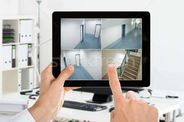 Homme regarder maison caméra cctv vidéos [[stock_photo]] © AndreyPopov