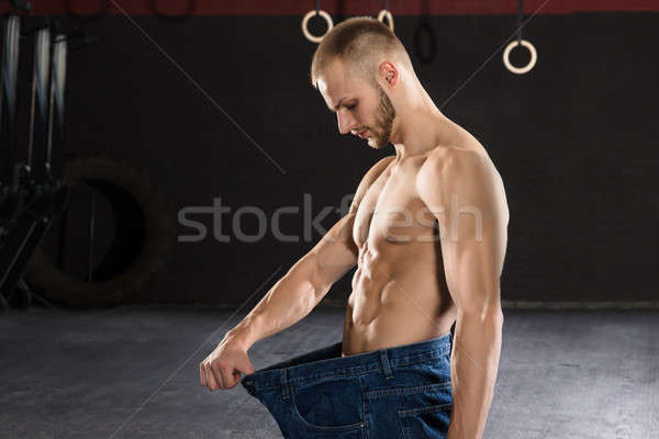 Homme détacher gymnase jeunes athlète Photo stock © AndreyPopov