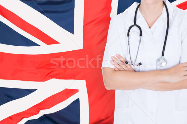Doctor Standing Against British Flag Stock photo © AndreyPopov