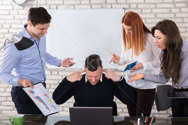 Angry Business People Pointing At Colleague Stock photo © AndreyPopov