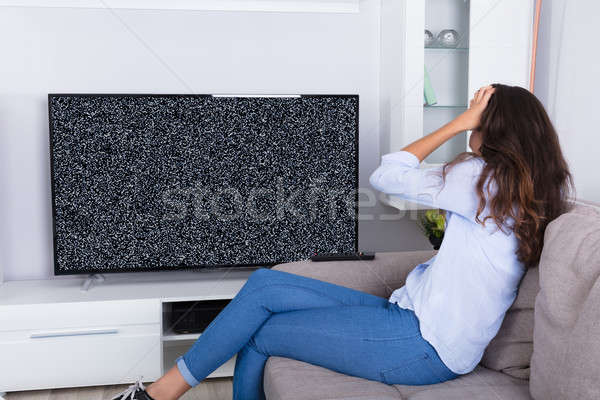 Mulher frustrado tv tela sofá Foto stock © AndreyPopov
