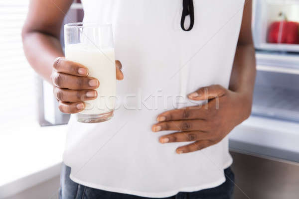 Mid Section View Of A Woman Holding Glass Of Milk Stock photo © AndreyPopov
