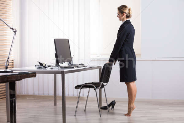 Businesswoman Stretching Her Legs Stock photo © AndreyPopov