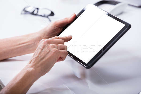 Woman Using Digital Tablet Stock photo © AndreyPopov